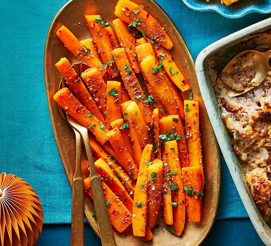 Hot honey carrots served on a gold oval plate