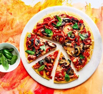 Pepper & mushroom socca pizza cut into slices