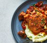 Slow cooker chicken casserole served on top of mashed potato