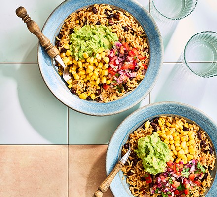 Burrito bowls with rice, black beans, sweetcorn and avocado