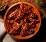 Air fryer soy & cranberry chicken wings in a small sharing bowl