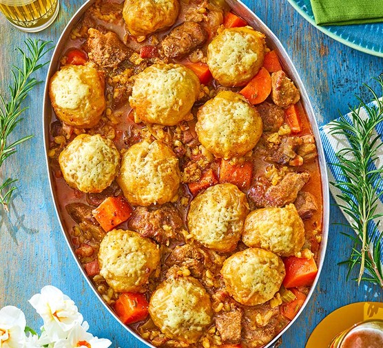 Lamb stew with fluffy rosemary & cheddar dumplings served in a baking dish