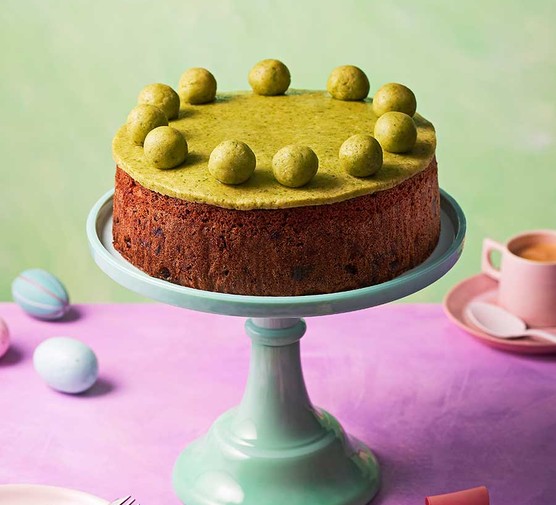 One sour cherry & pistachio simnel cake on a cake stand