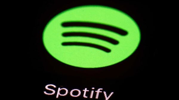 FILE- This March 20, 2018 file photo shows the Spotify app on an iPad in Baltimore. Music streaming service Spotify was down for many users on Thursday