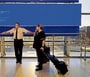 Airline employees wait by a departure monitor displaying the ’blue screen of death‘ at Newark airport on Friday following the global tech outage. (Airline employees wait by a departure monitor displaying the ’blue screen of death‘ at Newark airport on Friday following the global tech outage. reuters)