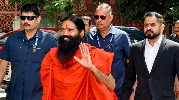  A file photo of Baba Ramdev arriving at the Supreme Court to attend a hearing relating to alleged misleading advertisements, in New Delhi on 30 April.  (ANI)