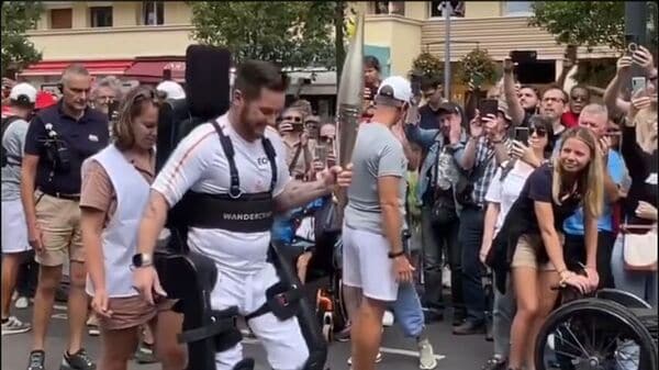 Screenshot of the video of a paraplegic tennis player Kevin Piette carrying the Olympic flame.