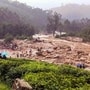 NNational Disaster Response Force (NDRF) personnel conducted a rescue operation after huge landslides in the hilly areas near Meppadi, in Wayanad district, Kerala. (PTI)