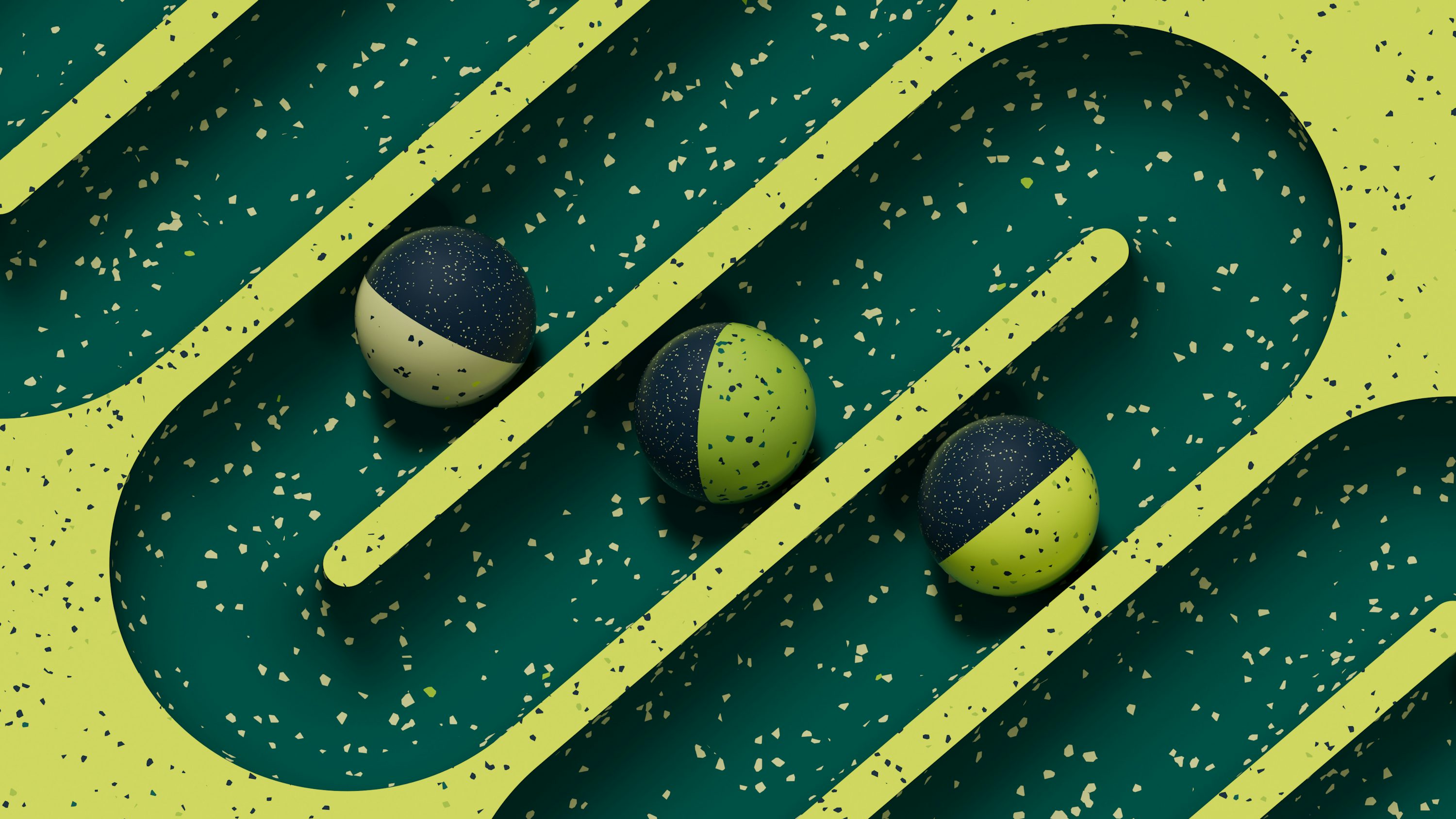 Tres bolas verdes y azules sentadas sobre una superficie verde