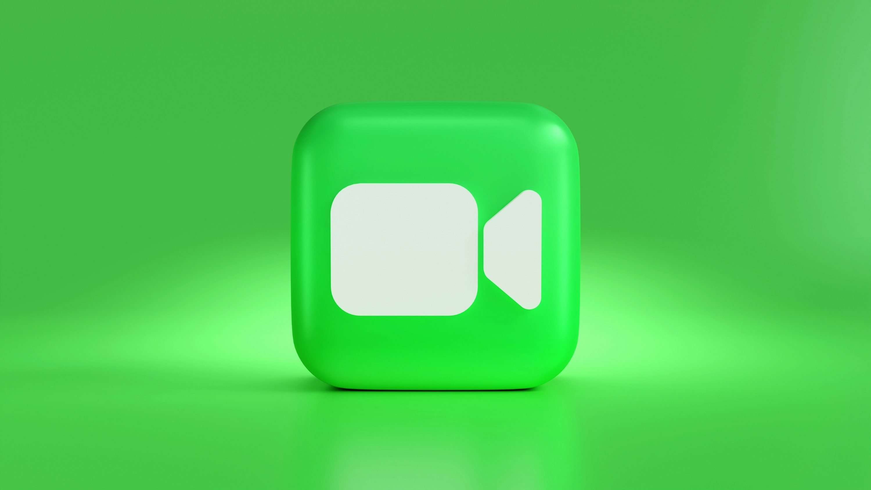 um botão quadrado verde com um balão de fala branco