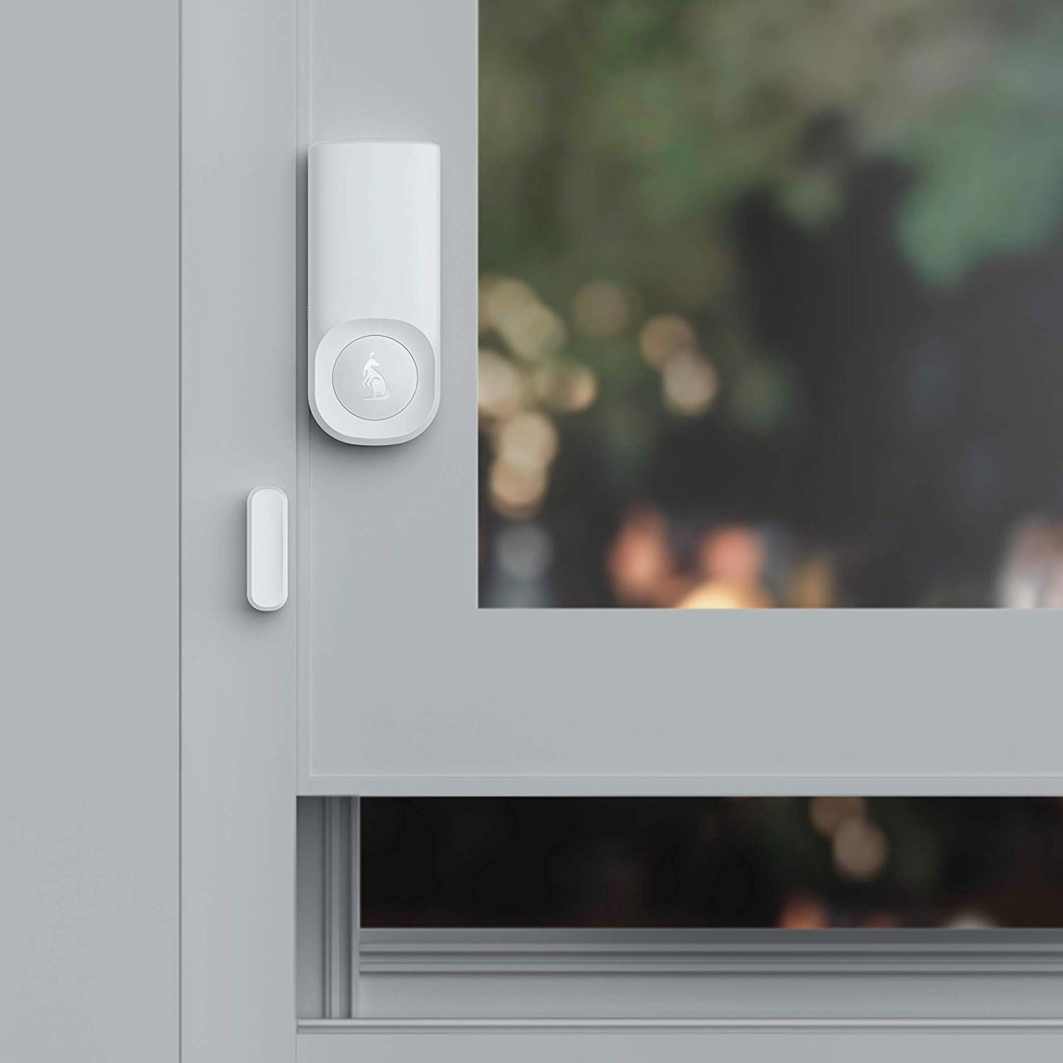 open window with minimalist white motion sensor for security