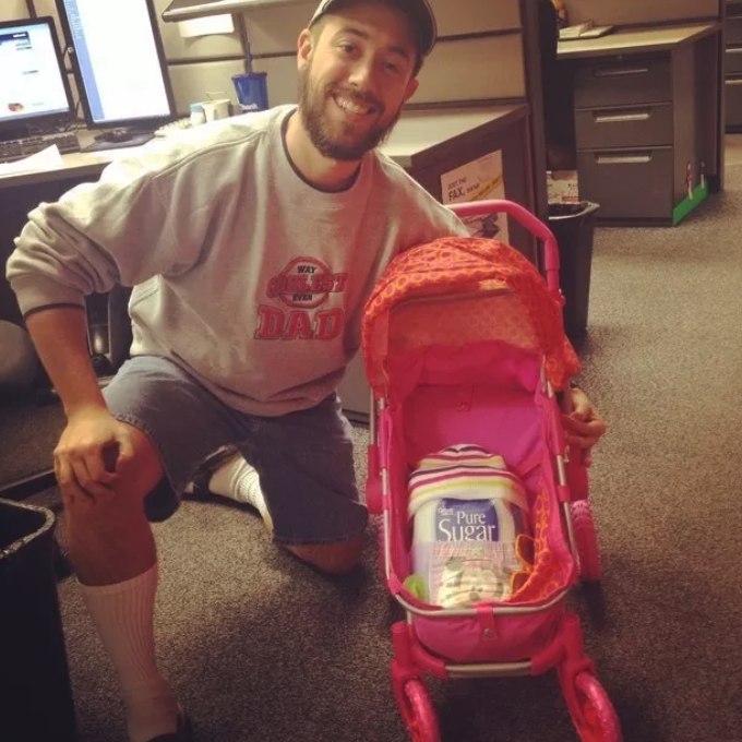 man pushing a stroller full of a sugar bag