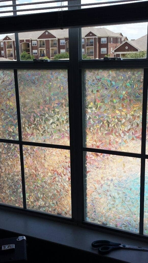 reviewer's window with holographic geometric frosted covering