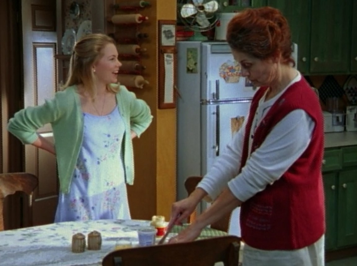 Jen talking to her Grams in the kitchen as her Grams butters toast