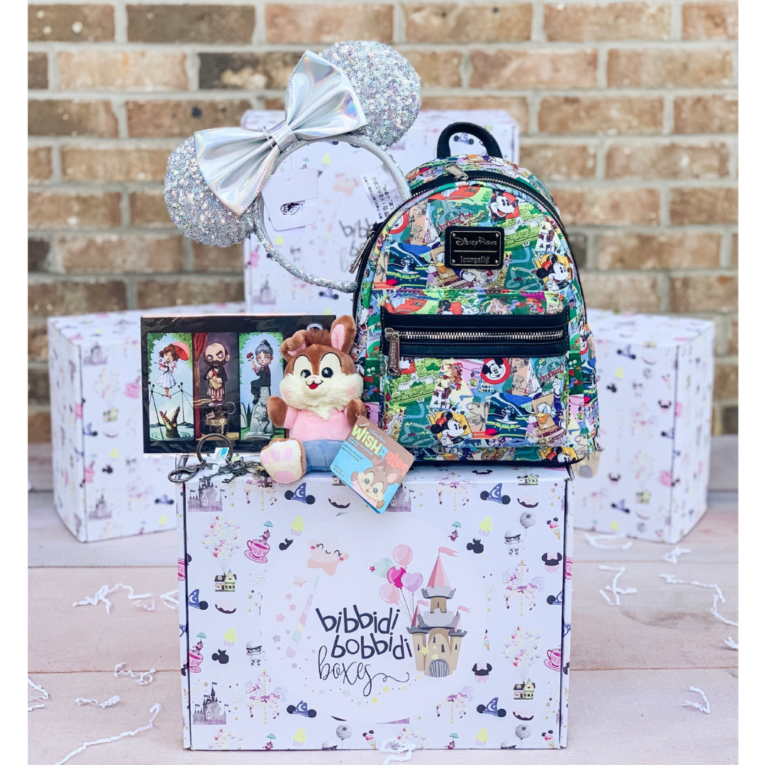 the subscription box pictured is their ultimate magic box which includes a Disney plush toy, a loungefly backpack, minnie mouse ears and two other Disney items