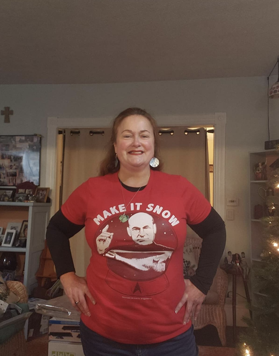 Reviewer wearing a red T-shirt with Captain Picard on it and the words &quot;make it snow&quot;