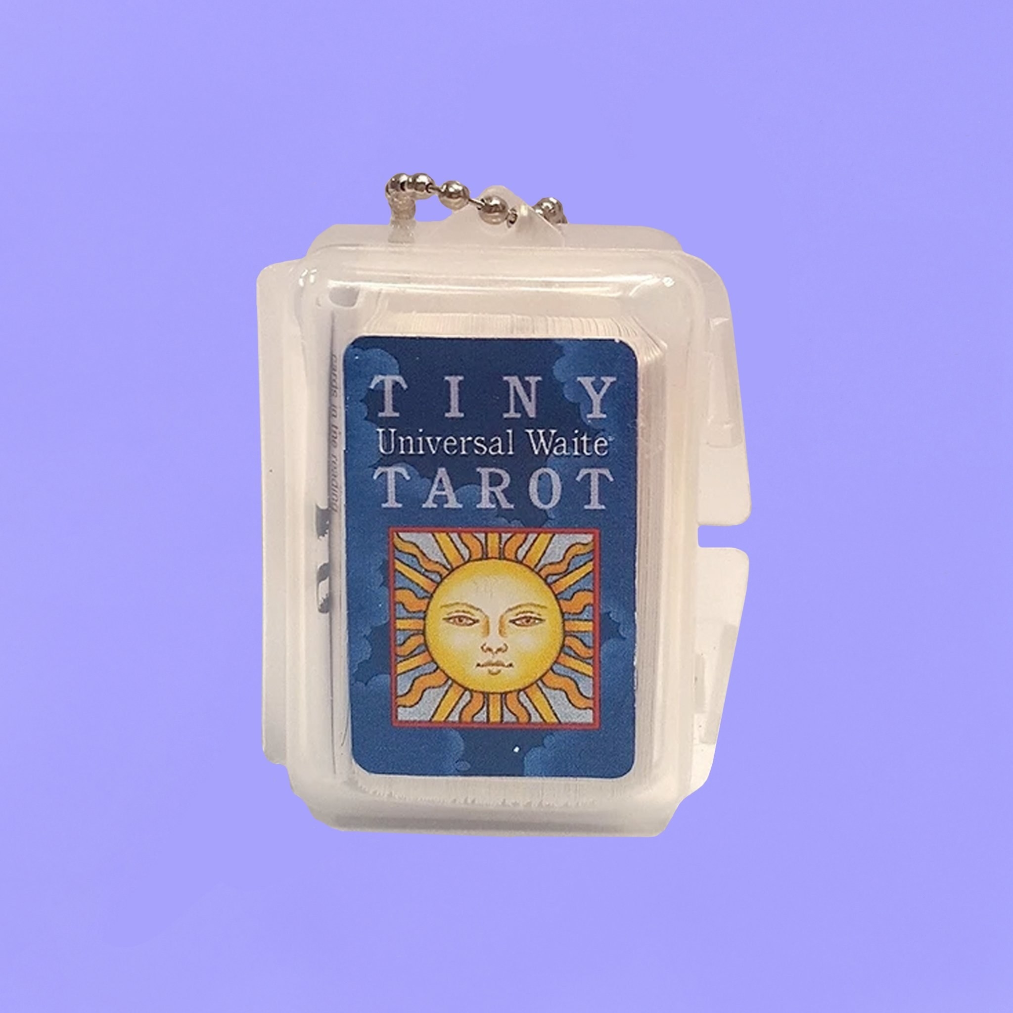 The tiny taro cards in their container which is attached to a keychain