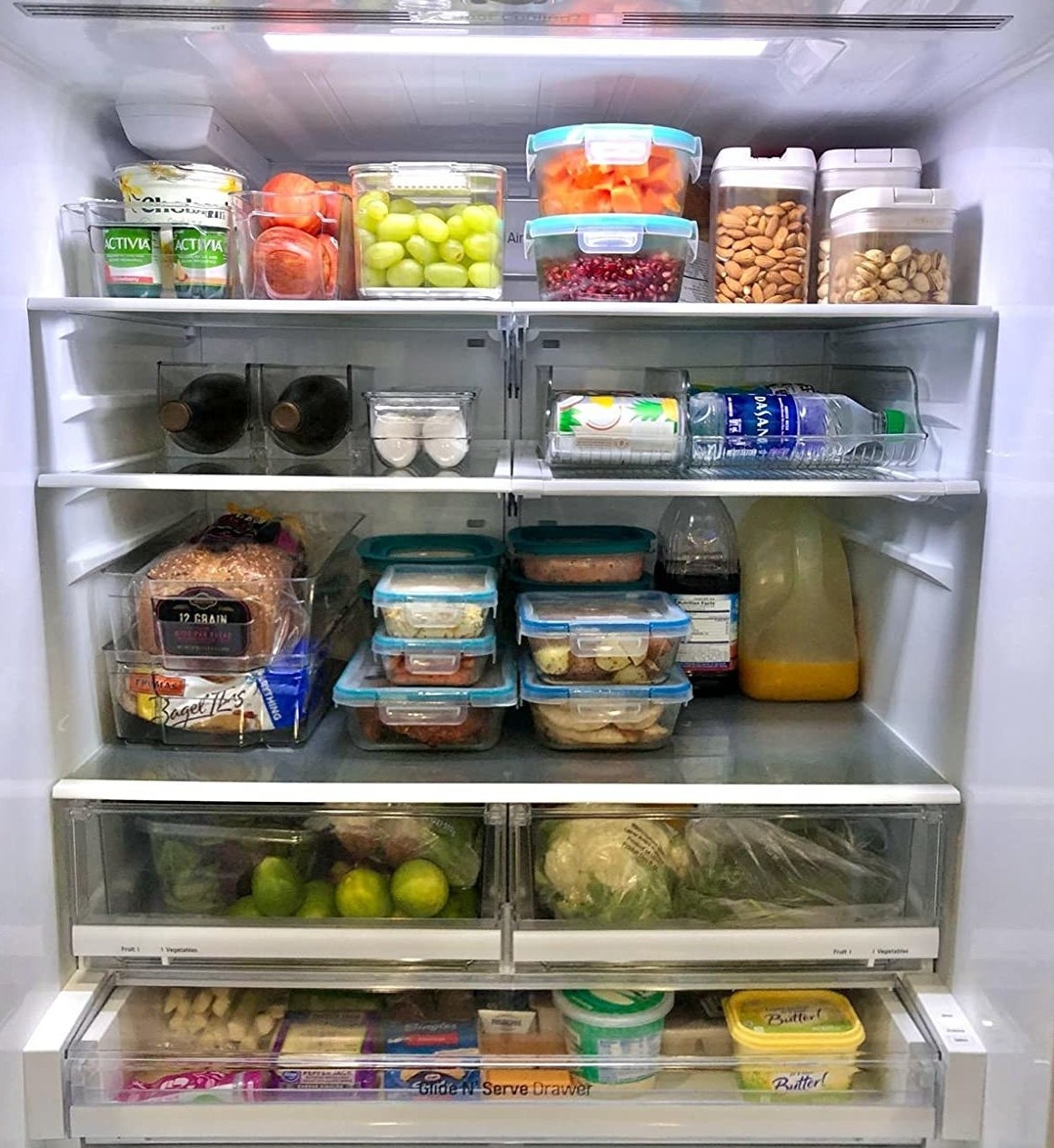 Reviewer photo showing the inside of a fridge organized using the bins