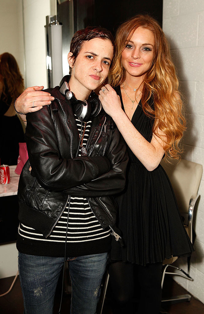 Lohan and Ronson posing together backstage at an event in 2009