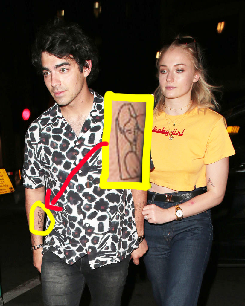an outline of her on his arm