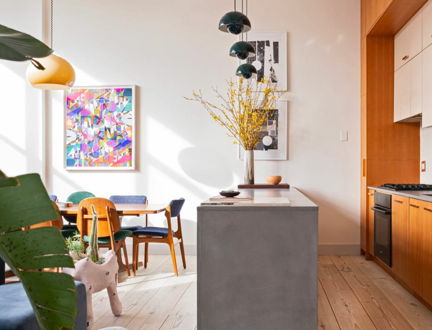 A beautiful kitchen and dining room is shown after a complete renovation