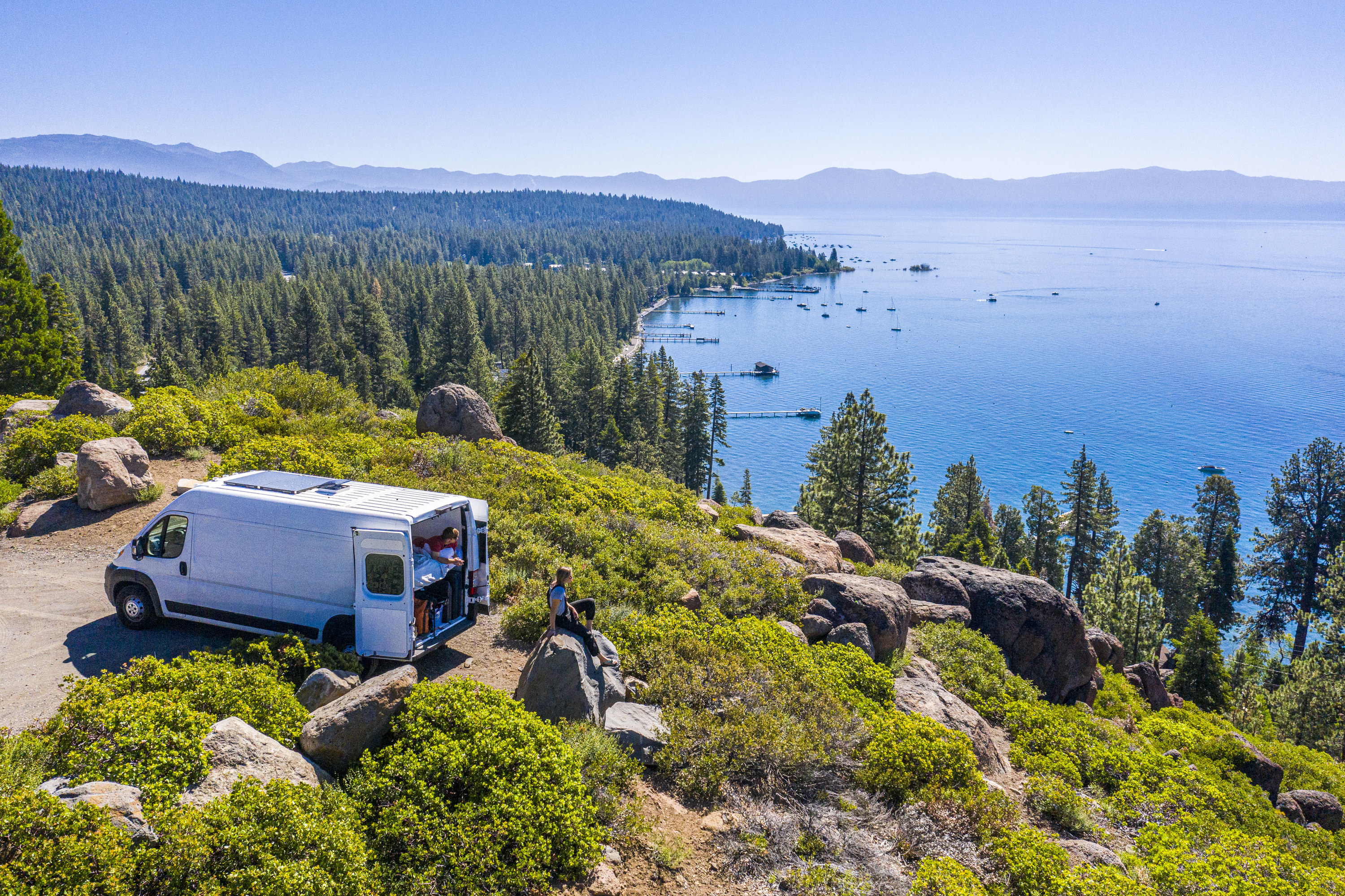 A Young Couple Parked Van at a Viewpoint of Lake Tahoe