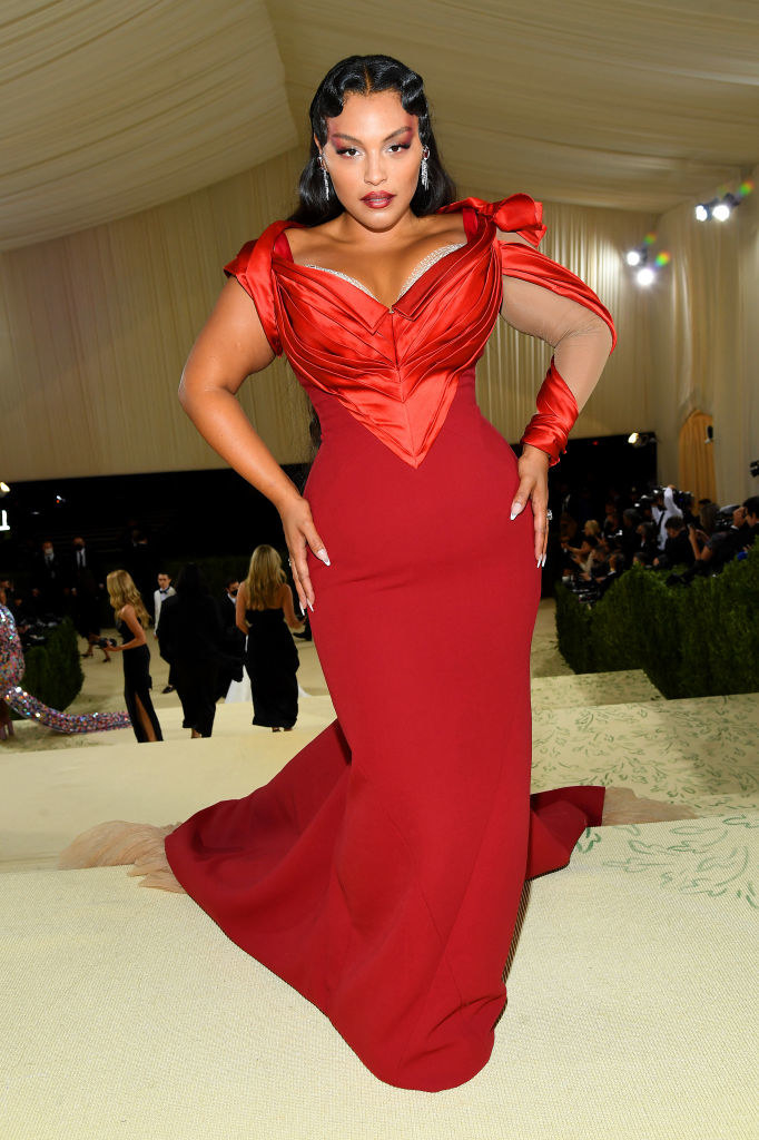 Paloma Elsesser wears a floor length tight bodice gown