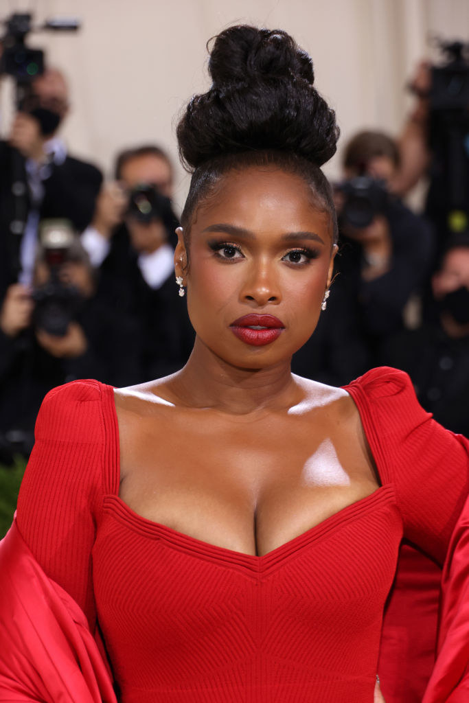 A close up of Jennifer Hudson as she shows off her natural makeup and bold lipstick