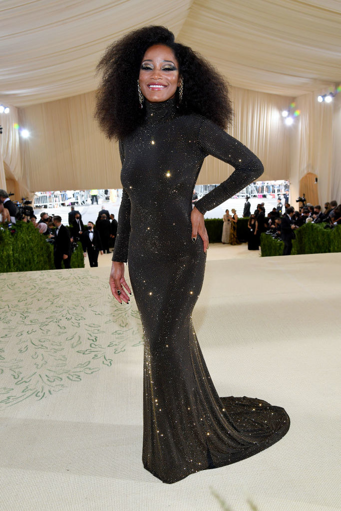 Keke Palmer wears a long sleeve floor length sparkly gown