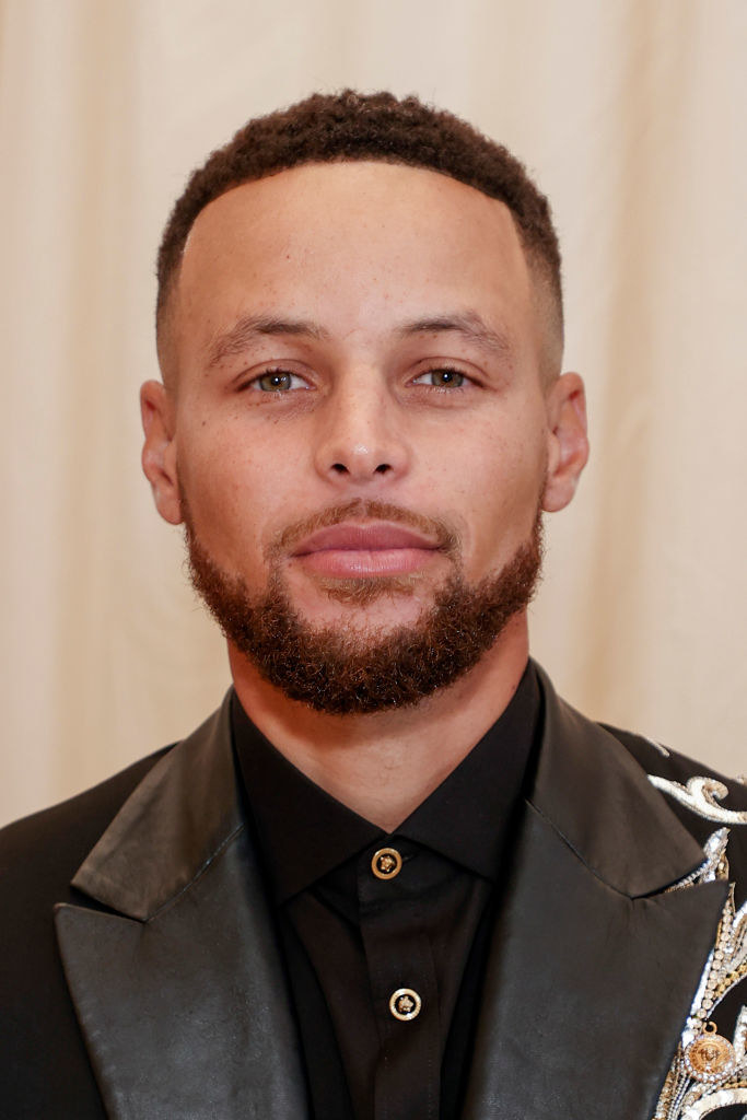 A close up of Stephen Curry as he smiles for the camera