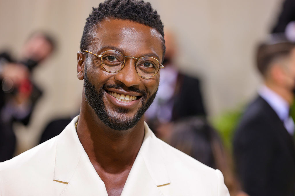 A close up of Aldis Hodge as he smiles