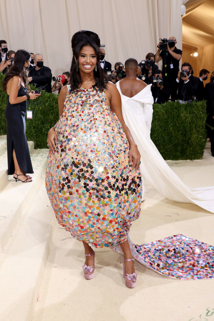 Natalia Bryant wears a floral gown with a bubble skirt and long train