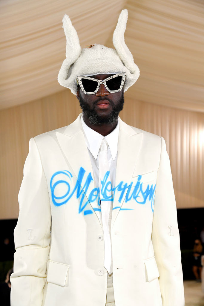 A close up of Virgil Abloh as he stands on the Met stairs