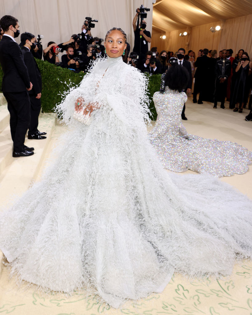 Allyson Felix wears a long sleeve fuzzy floor length gown