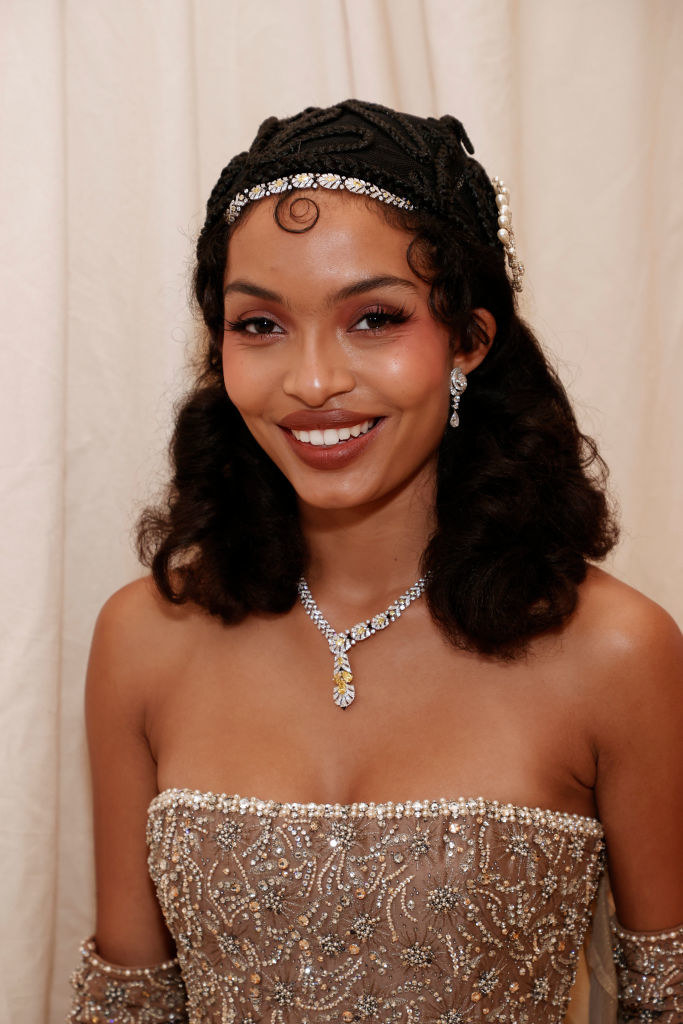 A close up of Yara Shahidi as she smiles brightly