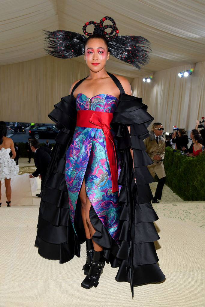 Naomi Osaka wears a Japanese-style dress with floor length ruffle sleeves