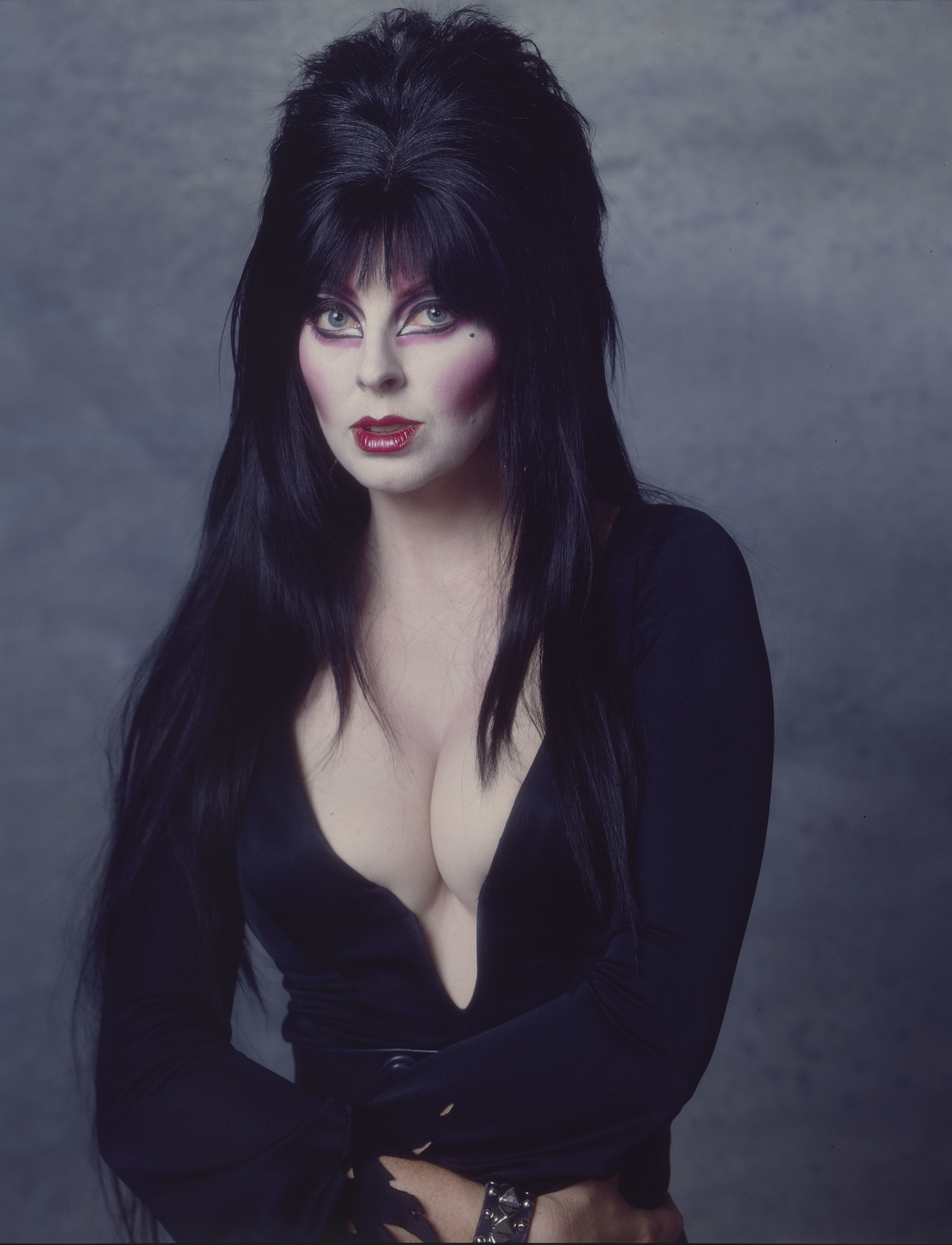 in her dark makeup and campy elvira outfit