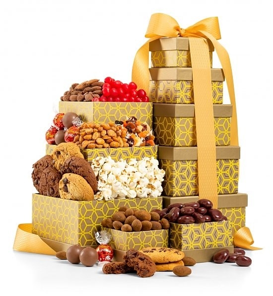 gold stacked boxes filled with delicious snacks