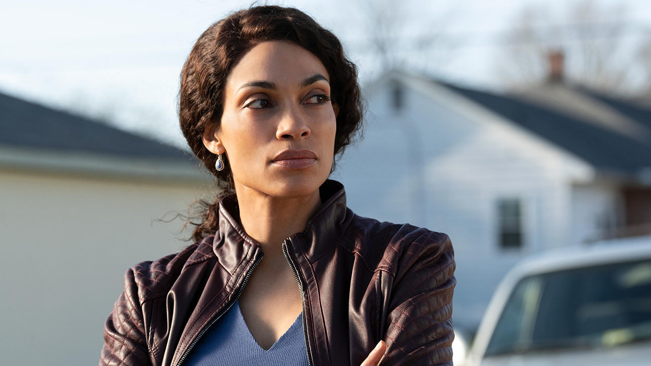 Rosario Dawson as Bridget Meyer stood in a suburb in &quot;Dopesick&quot;