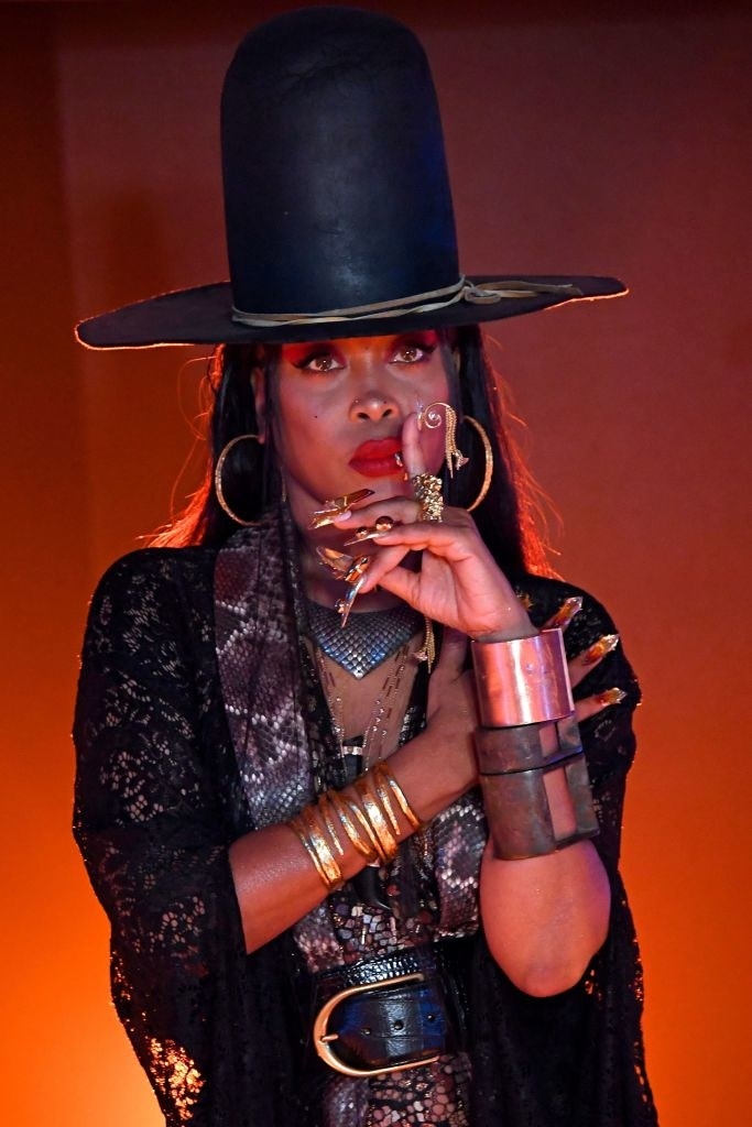 Erykah Badu performing on a stage