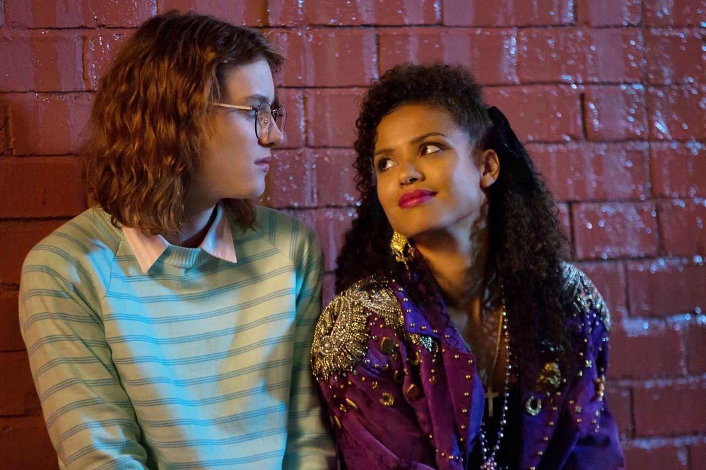 Mackenzie Davis as &quot;Yorkie&quot; is on the left looking at Gugu Mbatha-Raw as &quot;Kelly&quot; on the right.