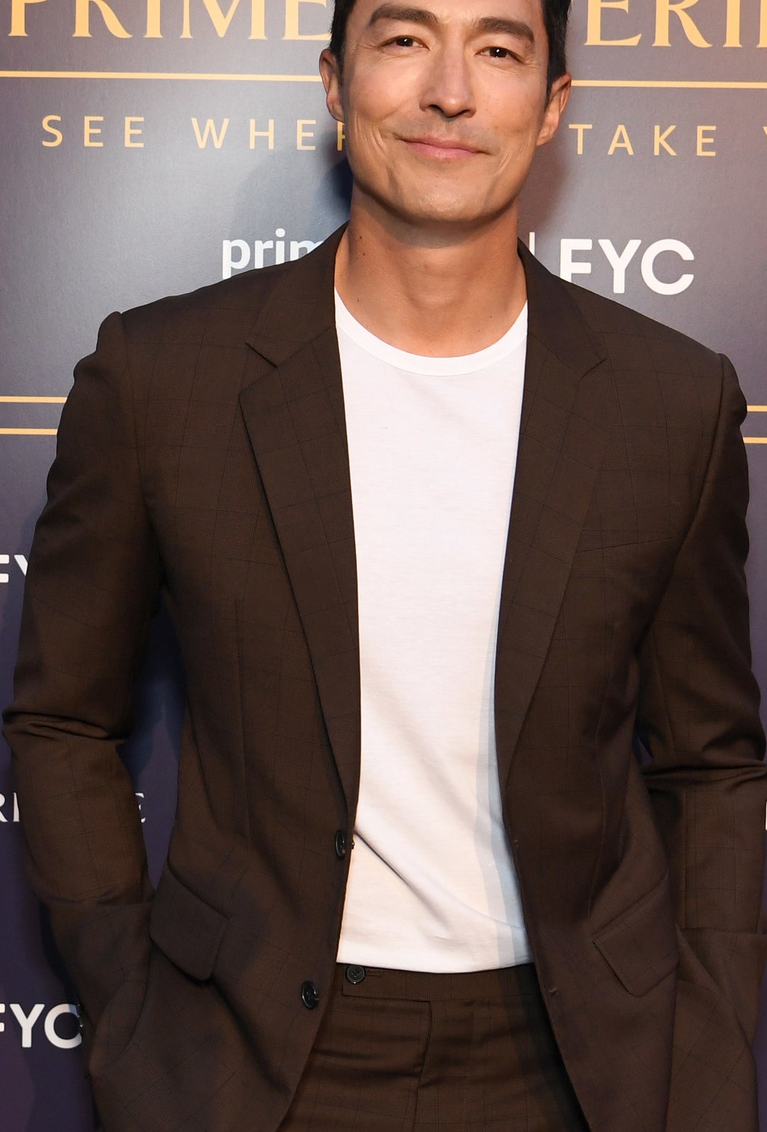 A closeup of Daniel Henney smiling