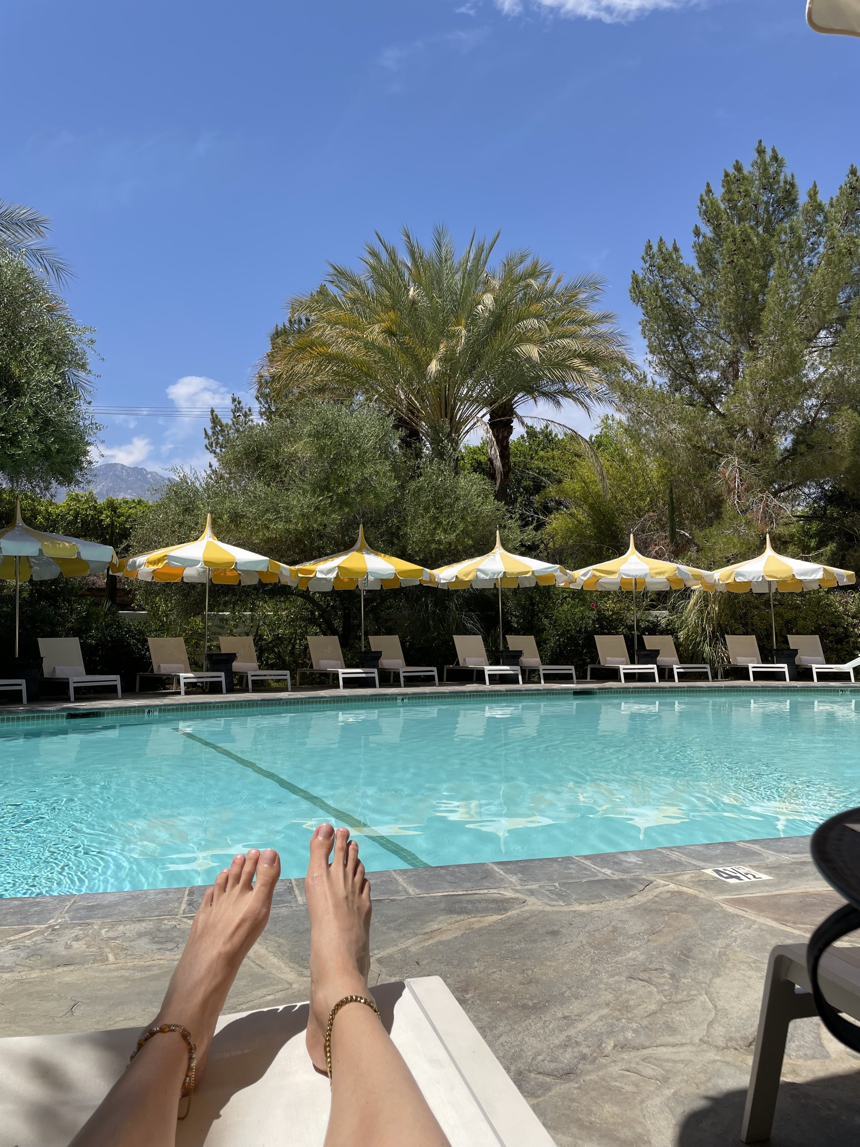 Lara&#x27;s feet by the pool