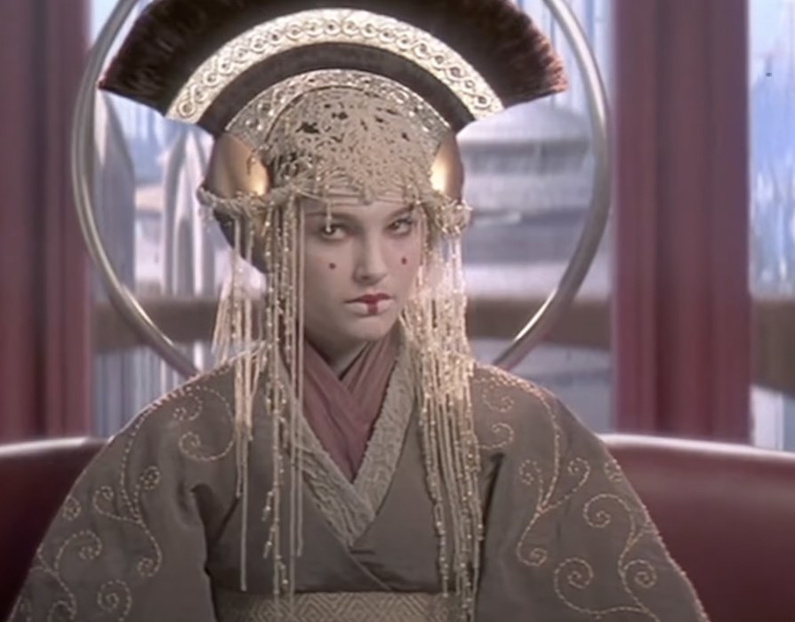 Natalie Portman as Queen Amidala in Star Wars: Episode I – The Phantom Menace, in elaborate headdress and robe