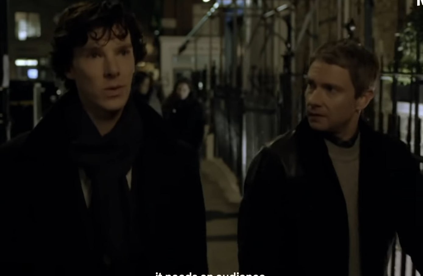 Sherlock and Watson walking down a street together at night in &quot;Sherlock&quot;