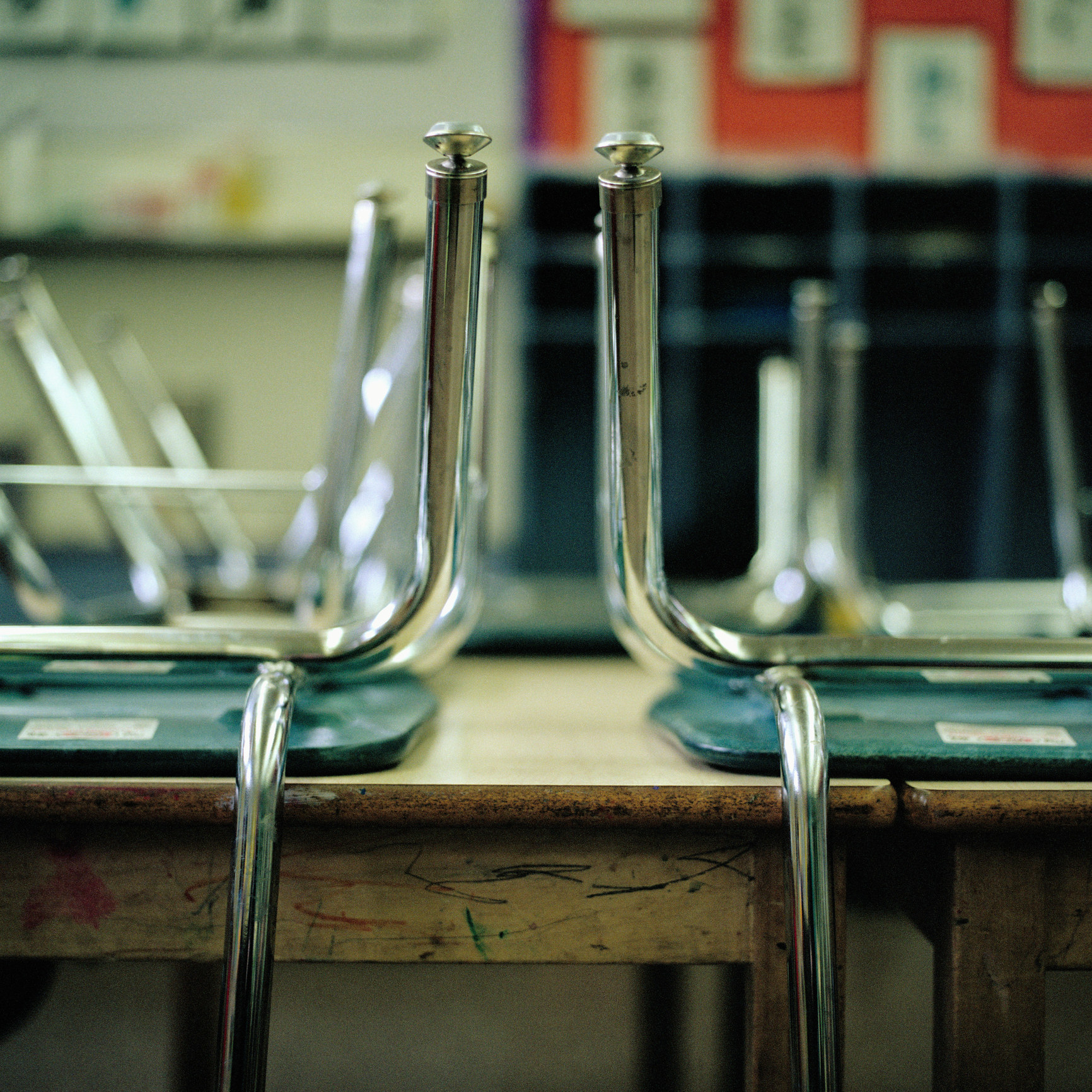 Chairs upside down on tables