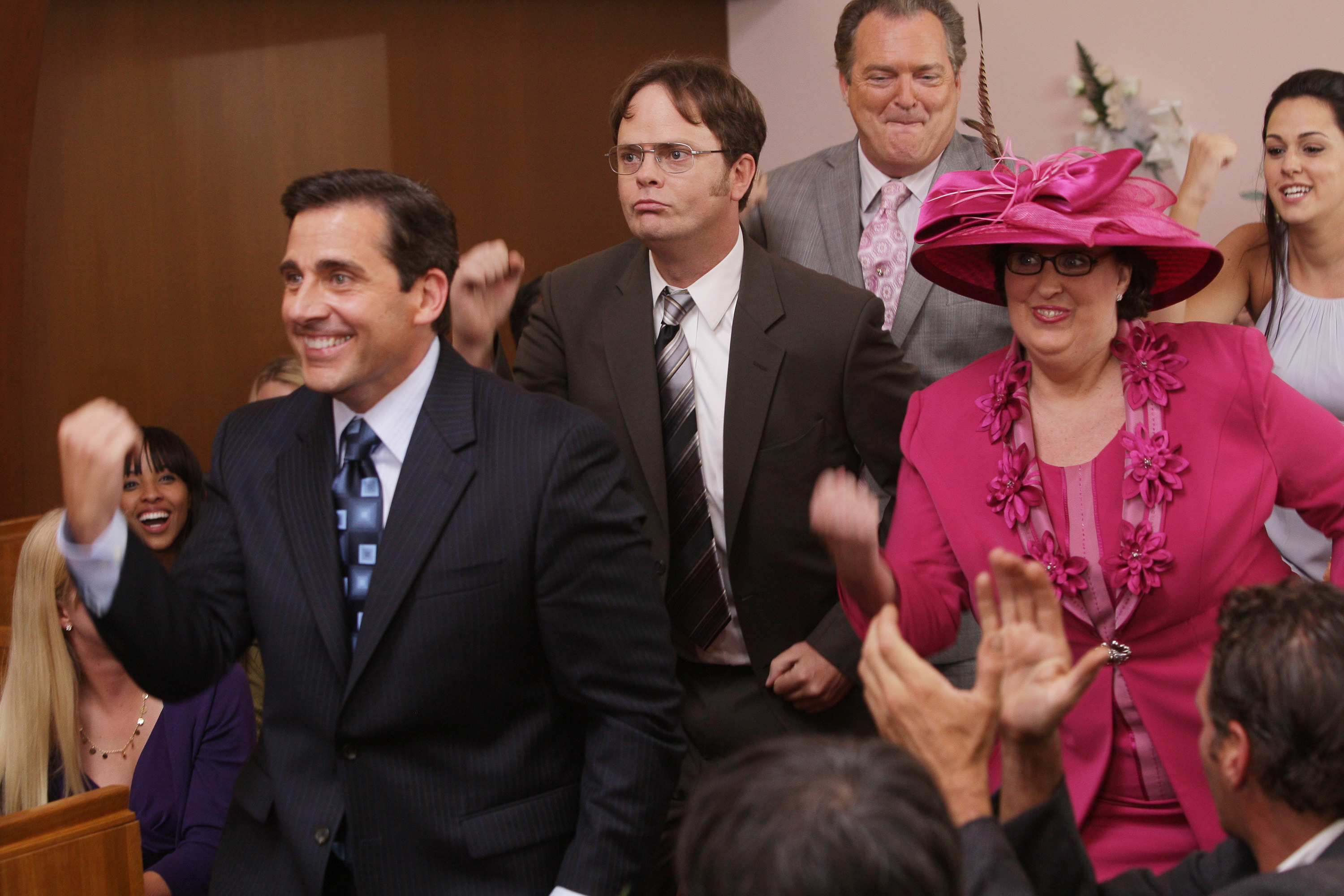 Steve Carell and Rainn Wilson dance down a wedding aisle.