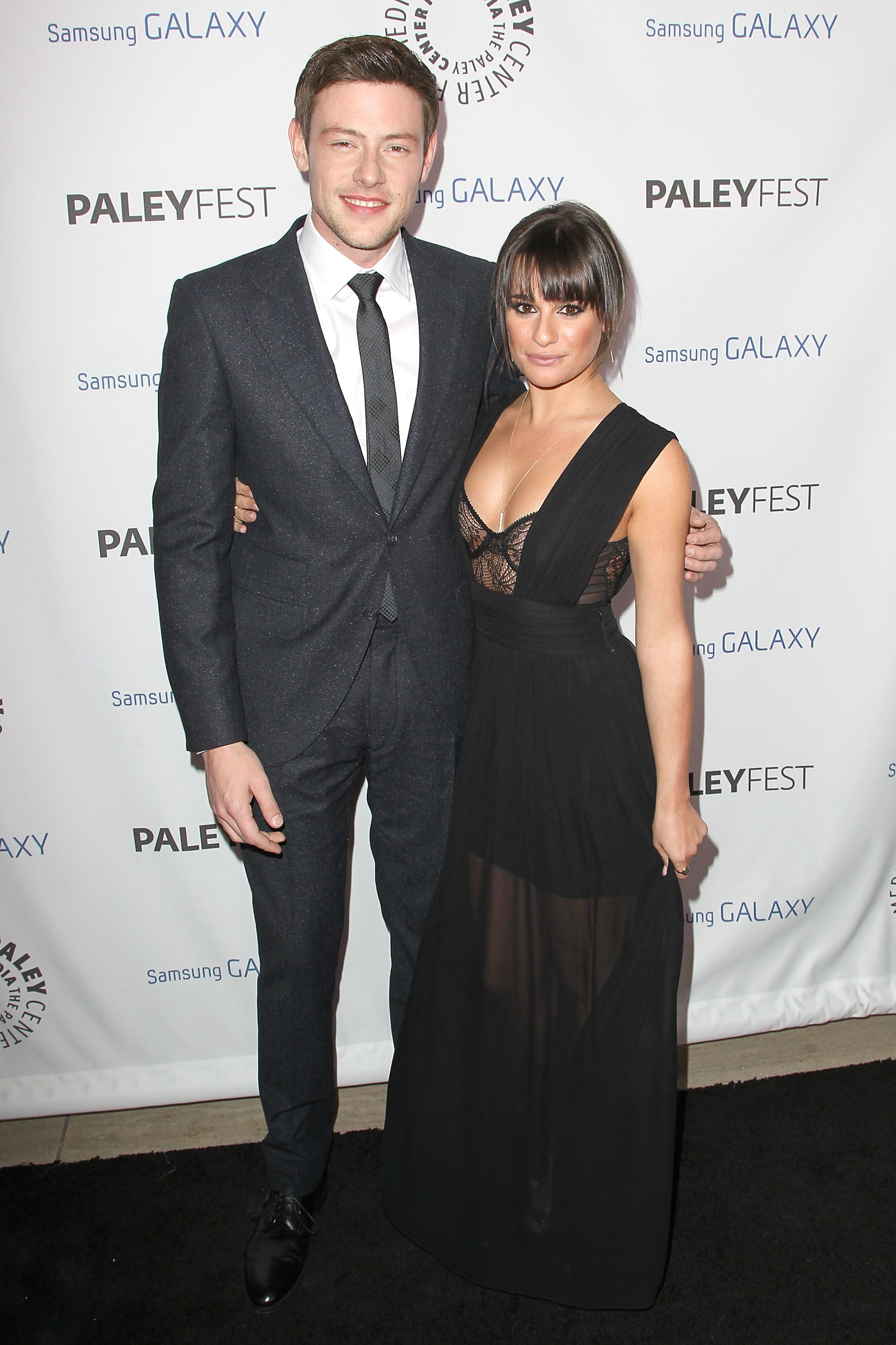 Cory and Lea pose together fat a red carpet event for photographers