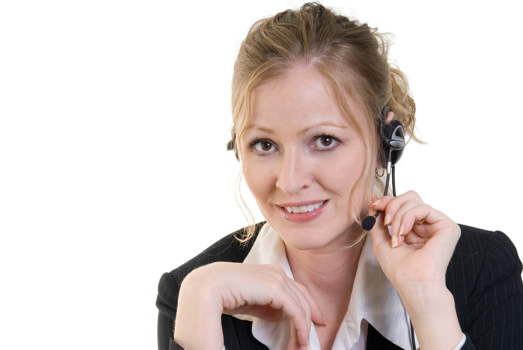 A woman wearing a telephone head set