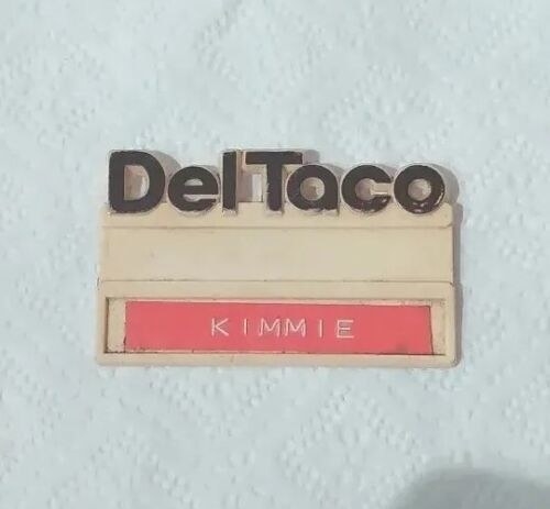 A Del Taco name badge with the name &quot;KIMMIE&quot; displayed on it